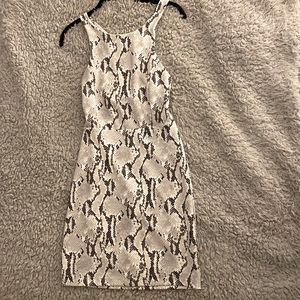 Express sexy printed mini dress with criss cross back. Size XS